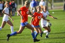 Bishop Gorman's Jaden Terrana (9) moves the ball in front of Coronado's Heather Mitchell during ...