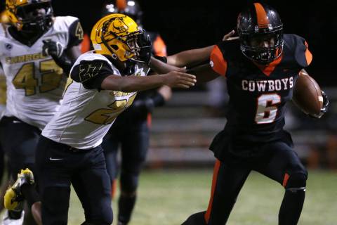 Chaparral's Al Caesar (6) runs the ball against Clark's Dominick Phillips (27) in the second qu ...