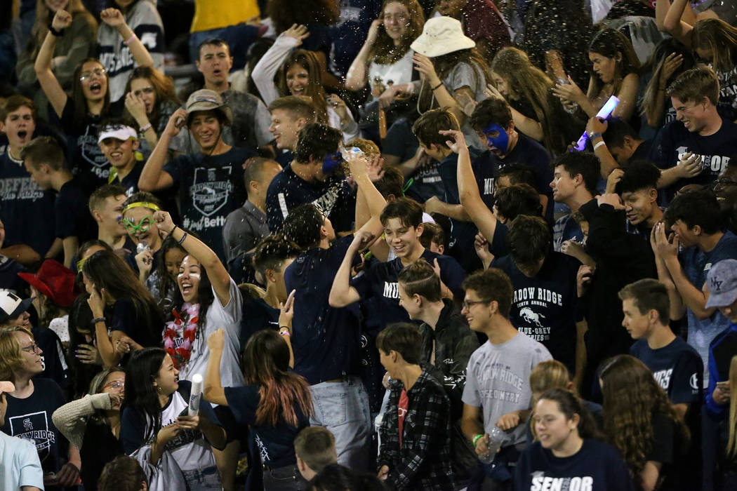 Shadow Ridge students make noise from the bleachers in the second quarter of the football game ...
