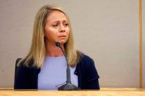 In a Friday, Sept. 27, 2019, file pool photo, fired Dallas police officer Amber Guyger becomes ...
