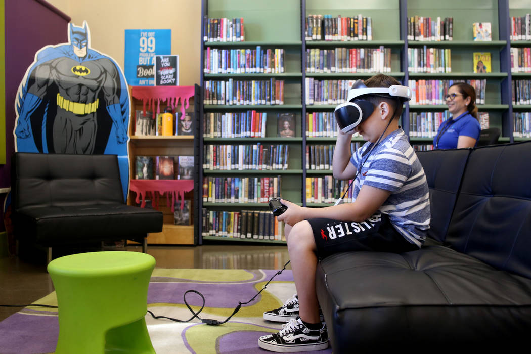 Dominic Giorgi, 10, Henderson, plays a PlayStation 4 VR game in the teen center at Green Valley ...