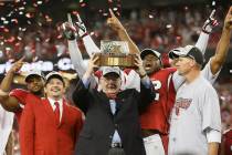 FILE - In this Jan. 8, 2009, file photo, Arizona Cardinals owner Bill Bidwell holds up the NFC ...