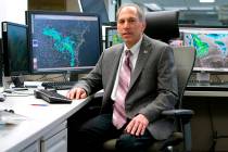 In this undated photo provided by NOAA, William Lapenta poses at the Weather Prediction Center, ...