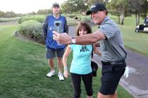 Phil Mickelson takes a selfie with fan Joan DeVaney of Saratoga Springs, N.Y. on the first tee ...