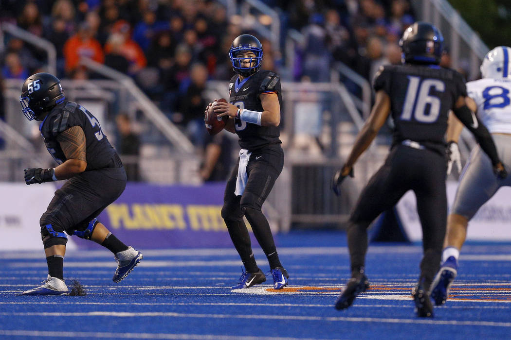 Boise State quarterback Hank Bachmeier (19) looks down field against the Air Force defense in t ...
