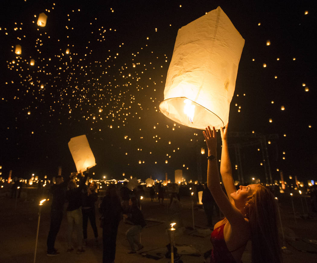 Delaney Evans releases her lantern during the RiSE Lantern Festival at Jean Dry Lake Bed on Fri ...