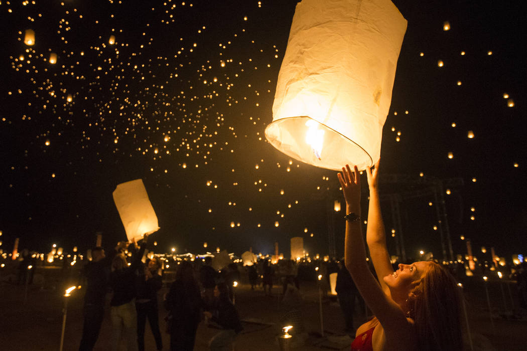 Delaney Evans releases her lantern during the RiSE Lantern Festival at Jean Dry Lake Bed on Fri ...