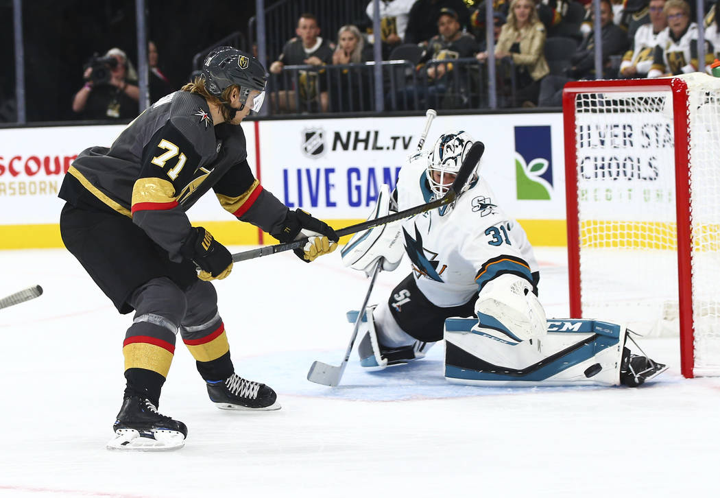 San Jose Sharks goaltender Martin Jones (31) blocks a shot from Golden Knights' William Karlsso ...