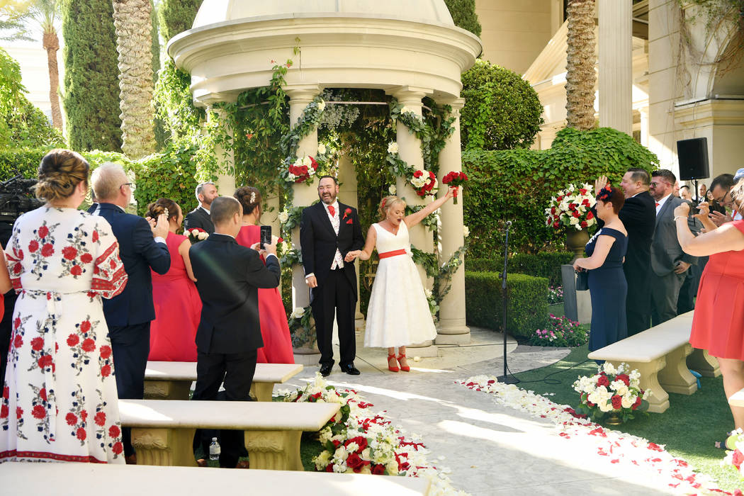Sharon Cook and Andrew Aitchison are shown at their wedding, arranged by Caesars Entertainment ...