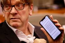 European Parliament Brexit chief Guy Verhofstadt shows on his phone a letter sent to the EU fro ...