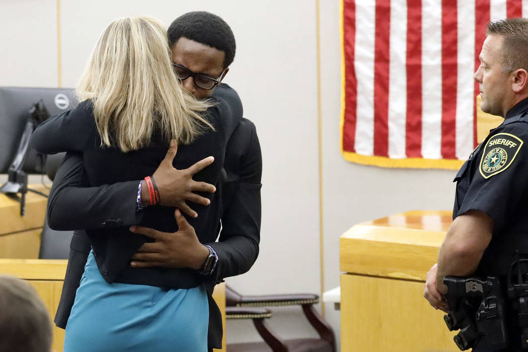 Botham Jean's younger brother Brandt Jean hugs convicted murderer and former Dallas Police Offi ...