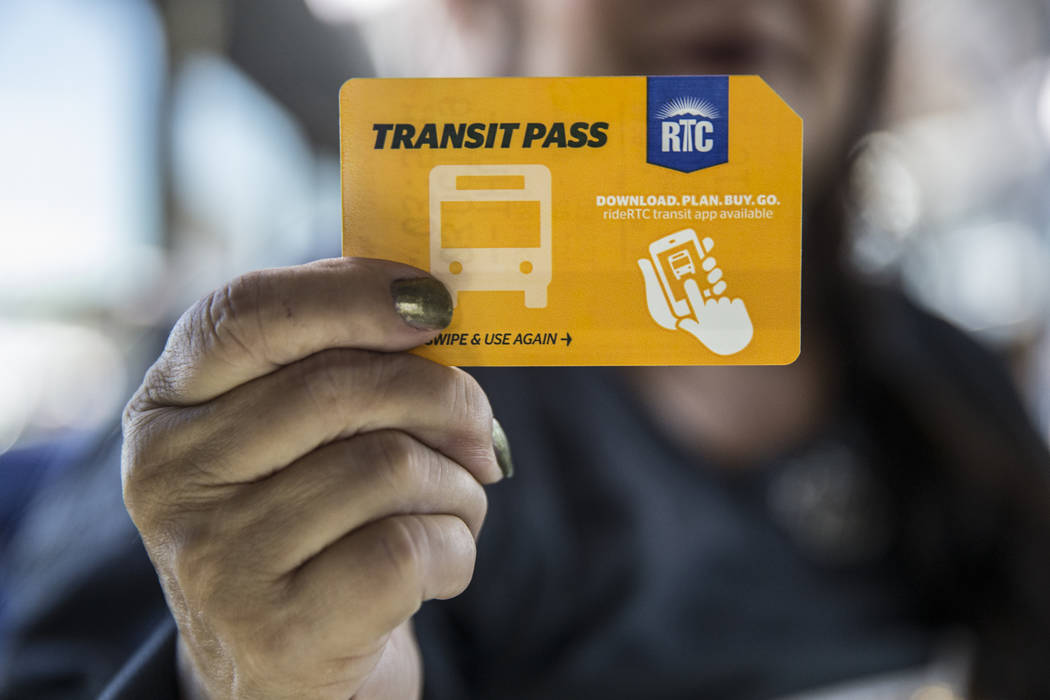 Elena Leger holds her one-day RTC bus pass while en route to Toshiba Plaza to watch the Vegas G ...