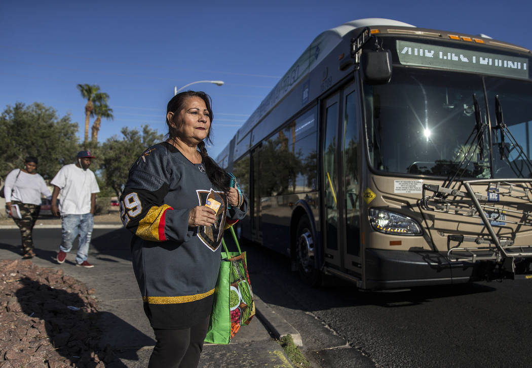 Elena Leger waits to board an RTC bus on East Tropicana Avenue to watch the Vegas Golden Knight ...