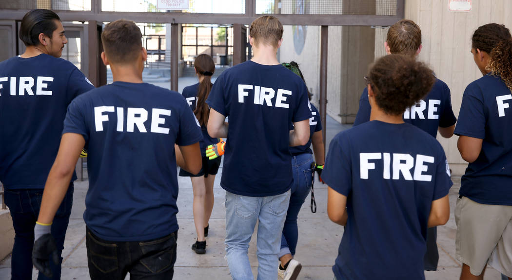 Bonanza High School Fire Science Academy students return to class after fire certification at t ...