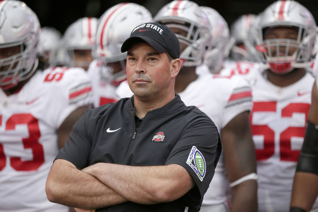 Ohio State head coach Ryan Day waits with his players before taking the field at Memorial Stadi ...