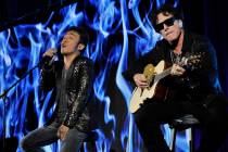 In this Aug. 6, 2013 file photo, Arnel Pineda, left, and Neal Schon of the rock band Journey pe ...