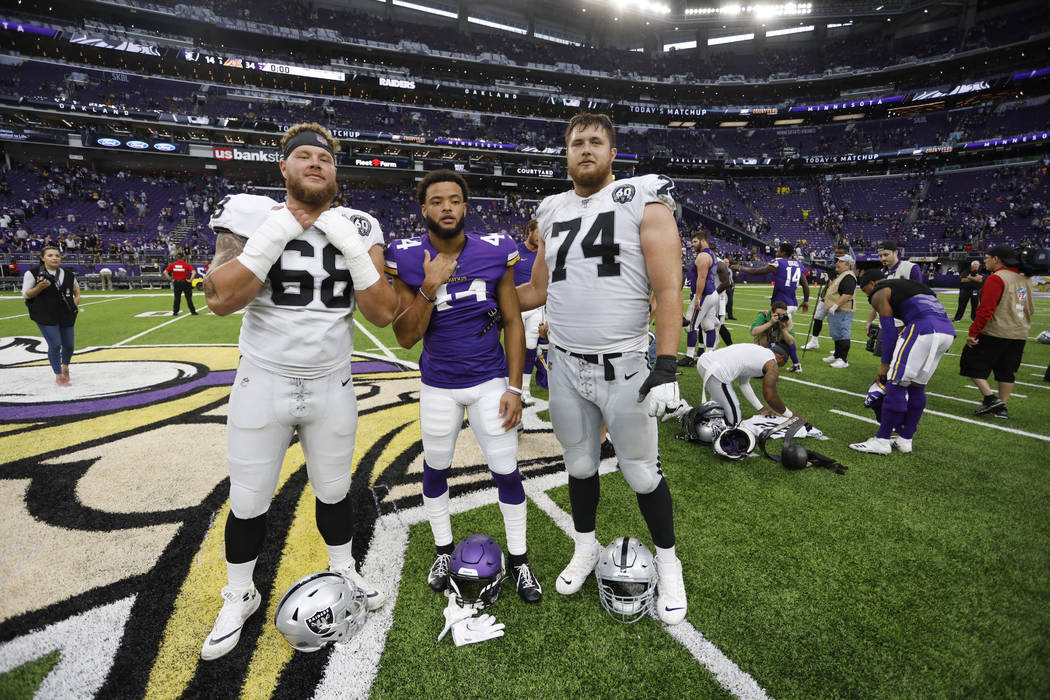Oakland Raiders offensive tackle Andre James, left, and offensive tackle Kolton Miller, right, ...