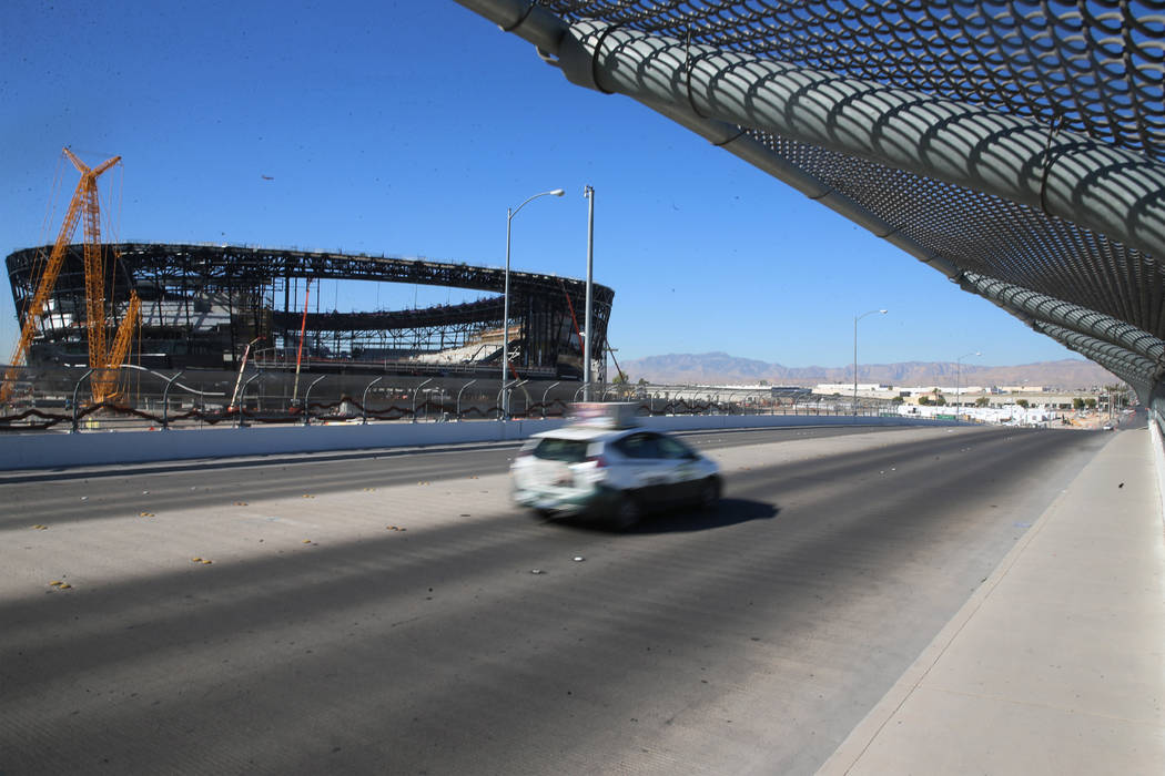 The view of the Raiders Allegiant Stadium from the Hacienda Avenue bridge in Las Vegas, Thursda ...