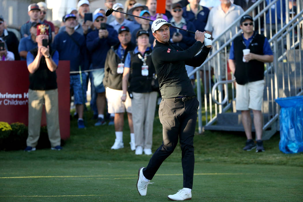 Adam Scott watches his tee shot on the 10th hole during Shriners Hospitals for Children Open at ...