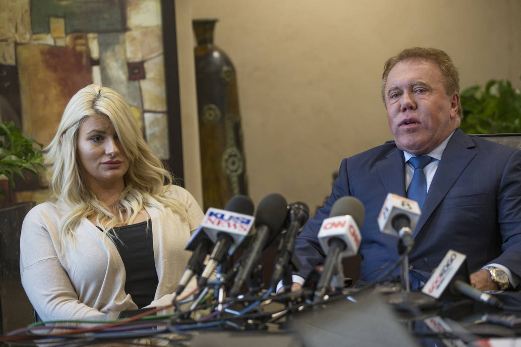 Chelsea Romo, a survivor of the mass shooting in Las Vegas, left, addresses the media with atto ...