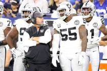 Oakland Raiders defensive coordinator Paul Guenther speaks with outside linebacker Vontaze Burf ...