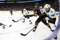 San Jose Sharks' Lean Bergmann (45) moves the puck in front of Golden Knights' Shea Theodore (2 ...