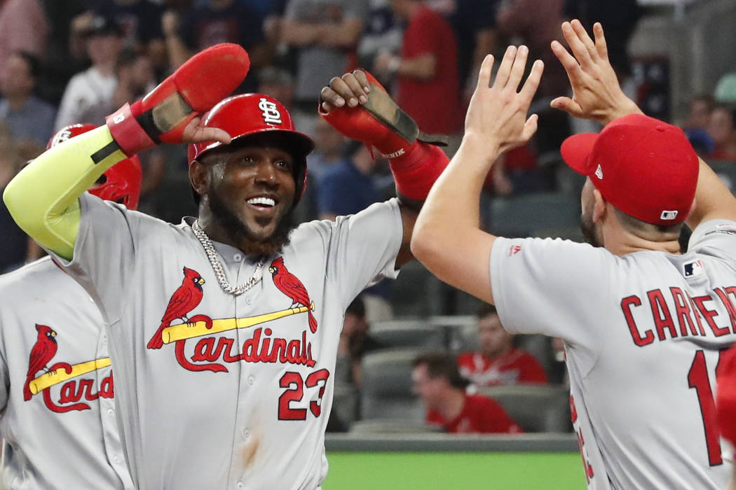 Cardinals score 4 in 9th, hold off Braves 7-6 in Game 1 of NLDS