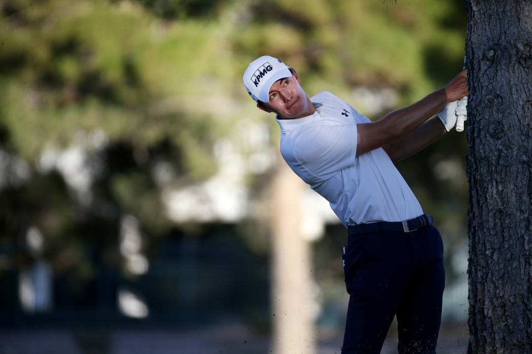 Maverick McNealy of Las Vegas hits from behind a tree on the 16th hole during Shriners Hospital ...