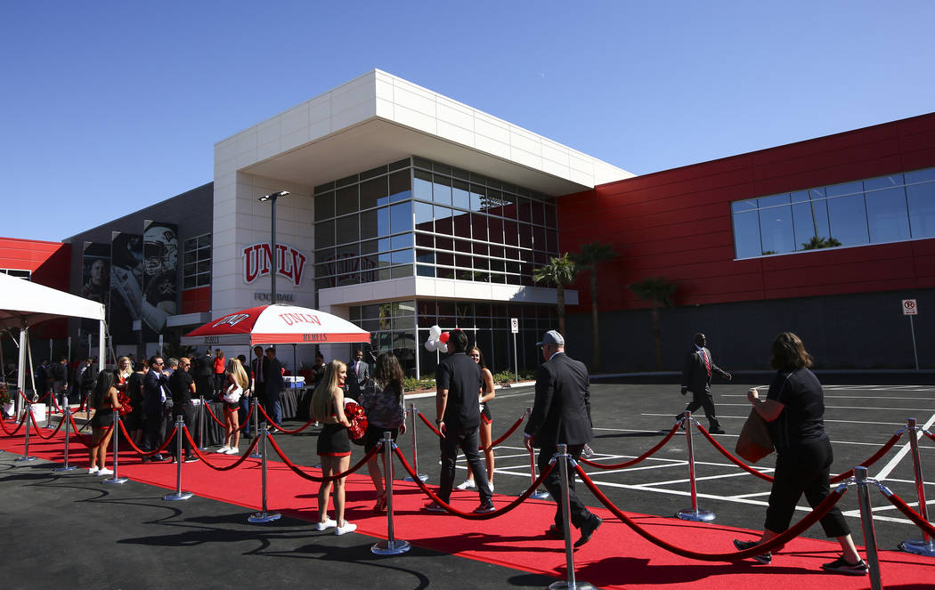 Attendees arrive for a ribbon cutting ceremony for the Fertitta Football Complex at UNLV in Las ...