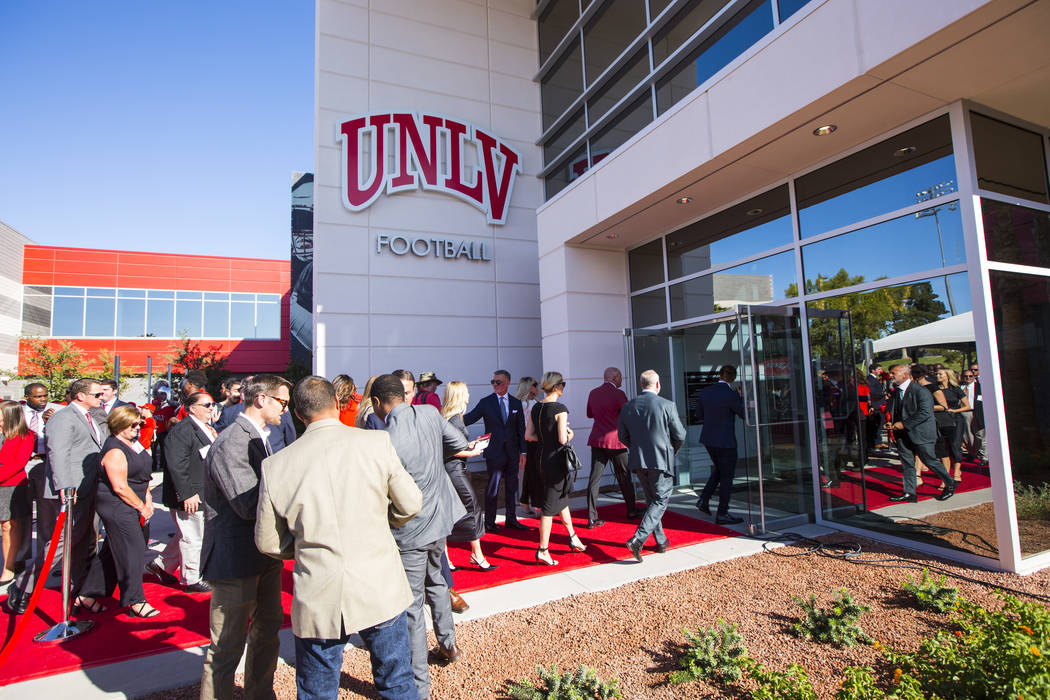 Attendees tour the Fertitta Football Complex following a ribbon cutting ceremony at UNLV in Las ...