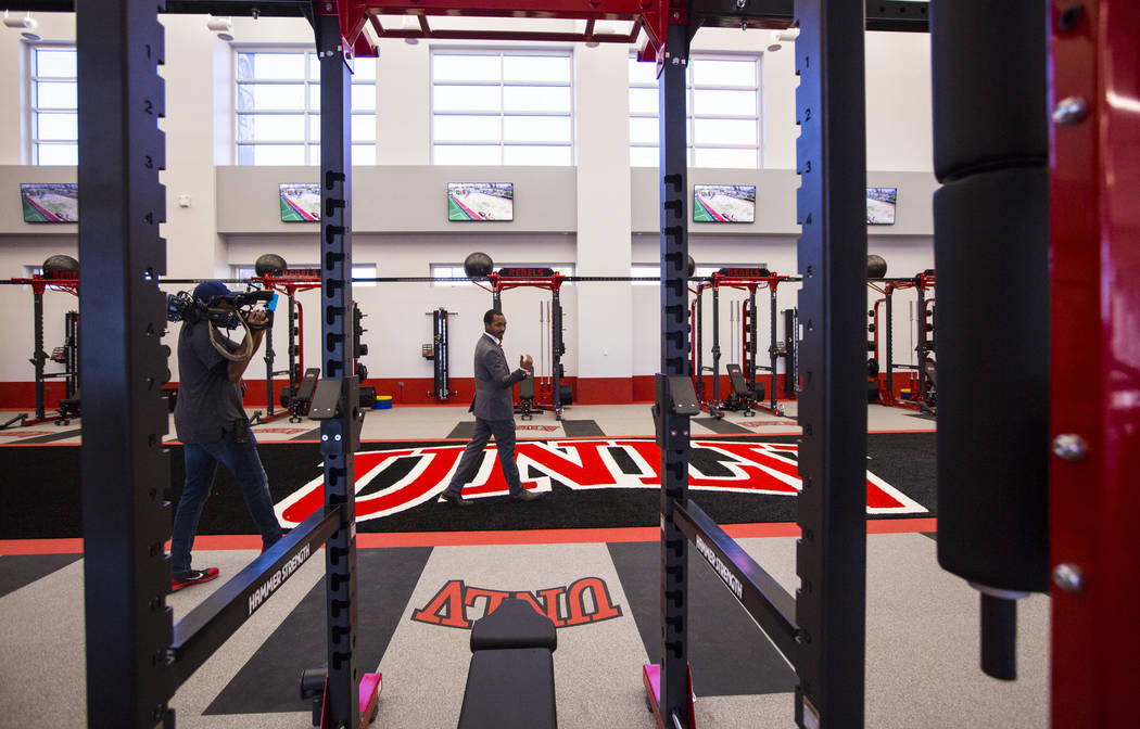 Duraunte Cutts, of UNLV, leads tour of the Fertitta Football Complex following the ribbon cutti ...