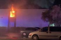 Flames are seen from a second-story apartment at 4264 Silver Dollar Ave. in central Las Vegas e ...