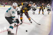 San Jose Sharks left wing Danil Yurtaykin (75) battles for control of the puck with Vegas Golde ...