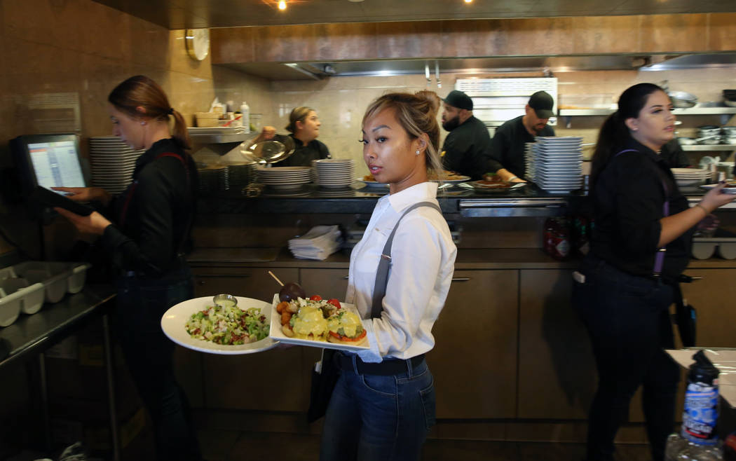 Heather Pascua serves food at Toasted Gastrobrunch at 9516 W. Flamingo Road on Thursday, Oct. 3 ...