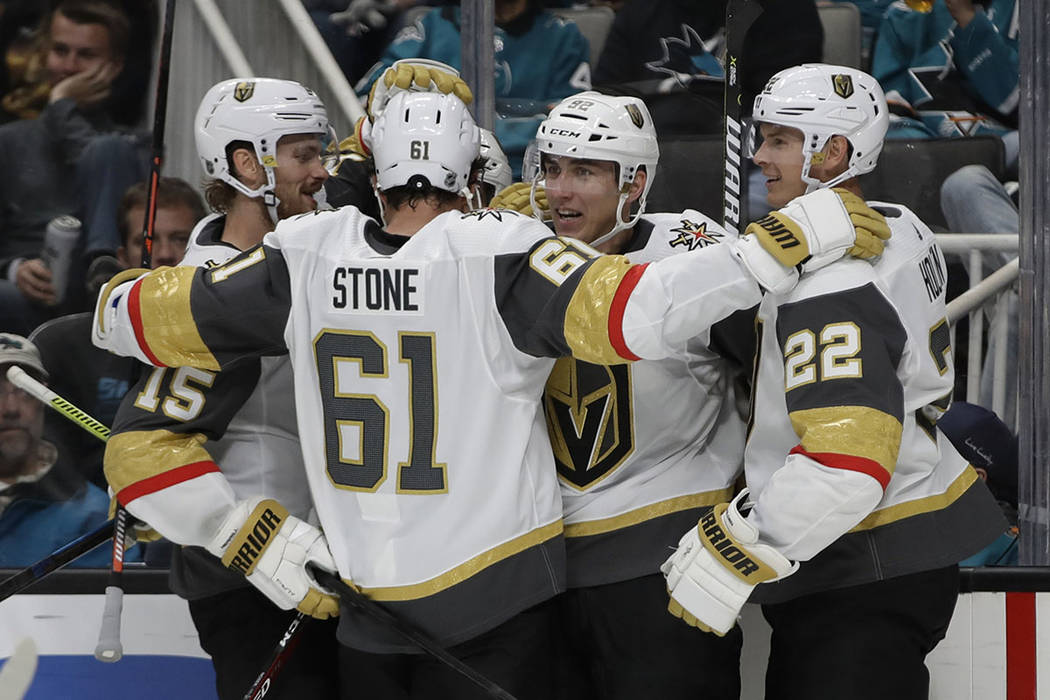 Vegas Golden Knights' Tomas Nosek, second from right, celebrates with Mark Stone (61) and Nick ...