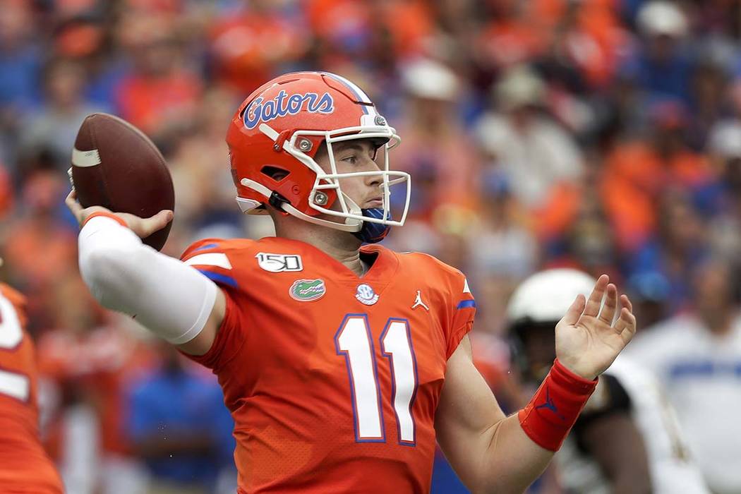 Florida quarterback Kyle Trask throws a pass against Towson during the first half of an NCAA co ...