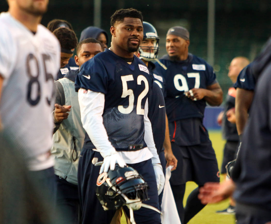 Chicago Bears linebacker Khalil Mack (52) walks off the Saracens RFC field following a practice ...