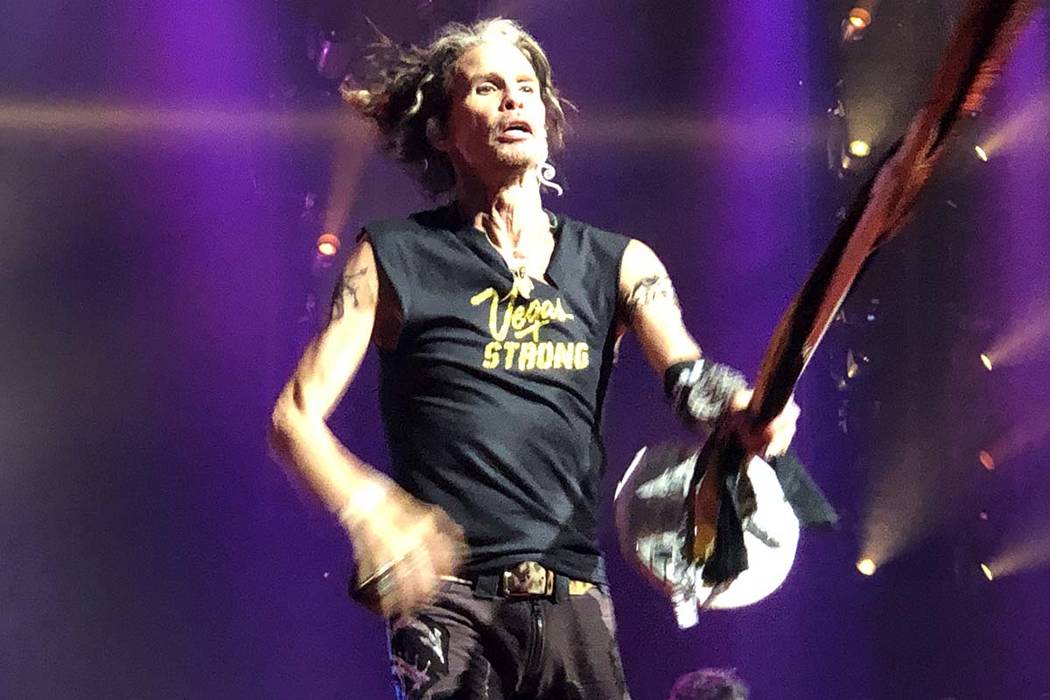 Steven Tyler performs "Come Together" in a T-shirt honoring Oct. 1 shooting victims at Aerosmit ...