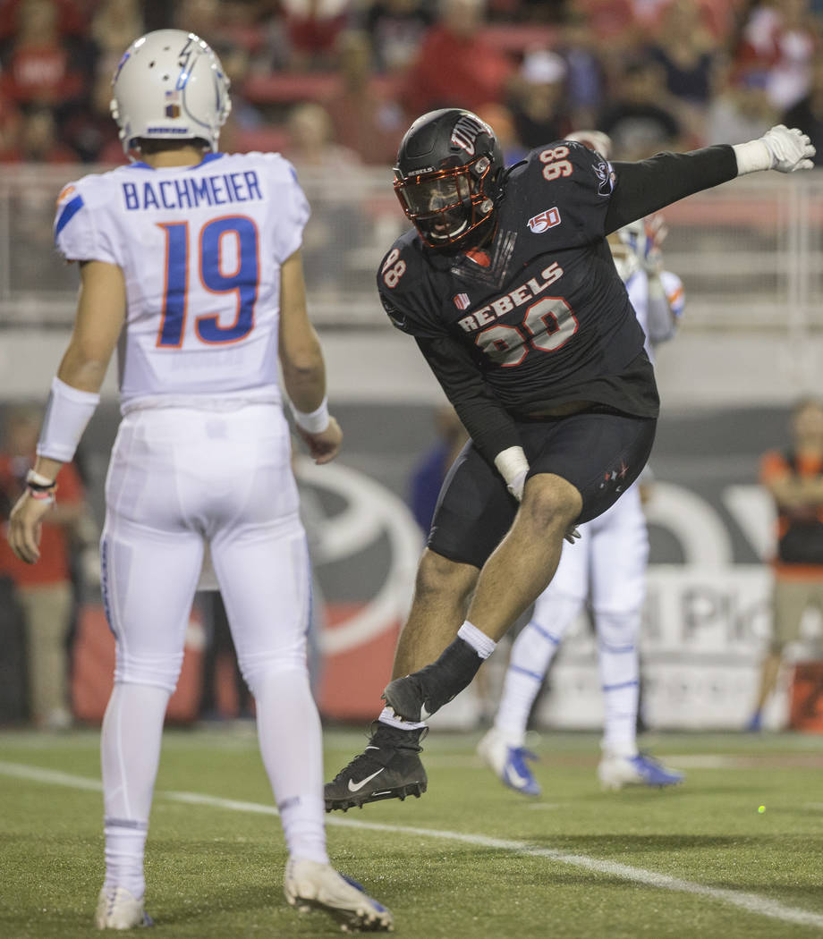 UNLV Rebels defensive lineman Nick Dehdashtian (98) leaps to try and block the pass of Boise St ...
