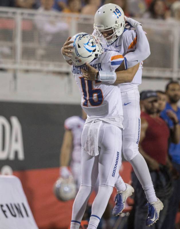 Boise State Broncos wide receiver John Hightower (16) celebrates with Boise State Broncos quart ...