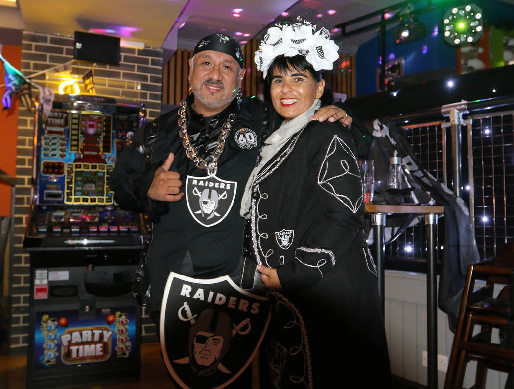 Jesse and Laura Maldonado, right, of Monterey, Calif., attend a Raiders' fan event at the Sport ...