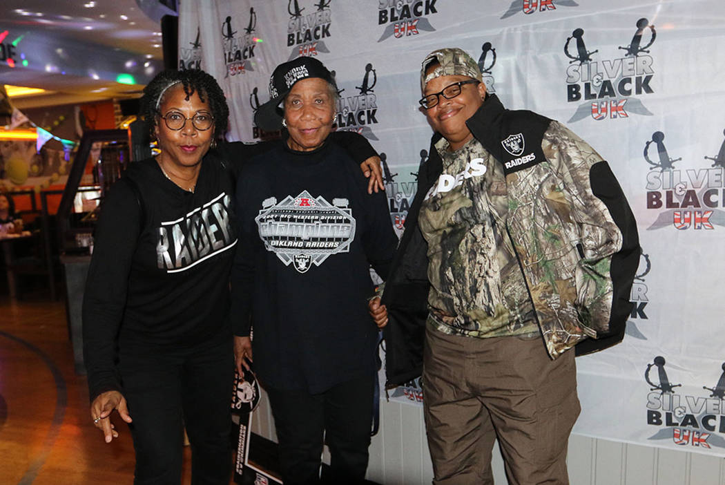 Maryland-based fans Lisa Klempko, left, and Barbara Johnson, center, and Las Vegas-based fan Br ...