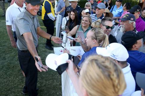 Phil Mickelson signs autographs after finishing up on the 18th hole during second round of Shri ...