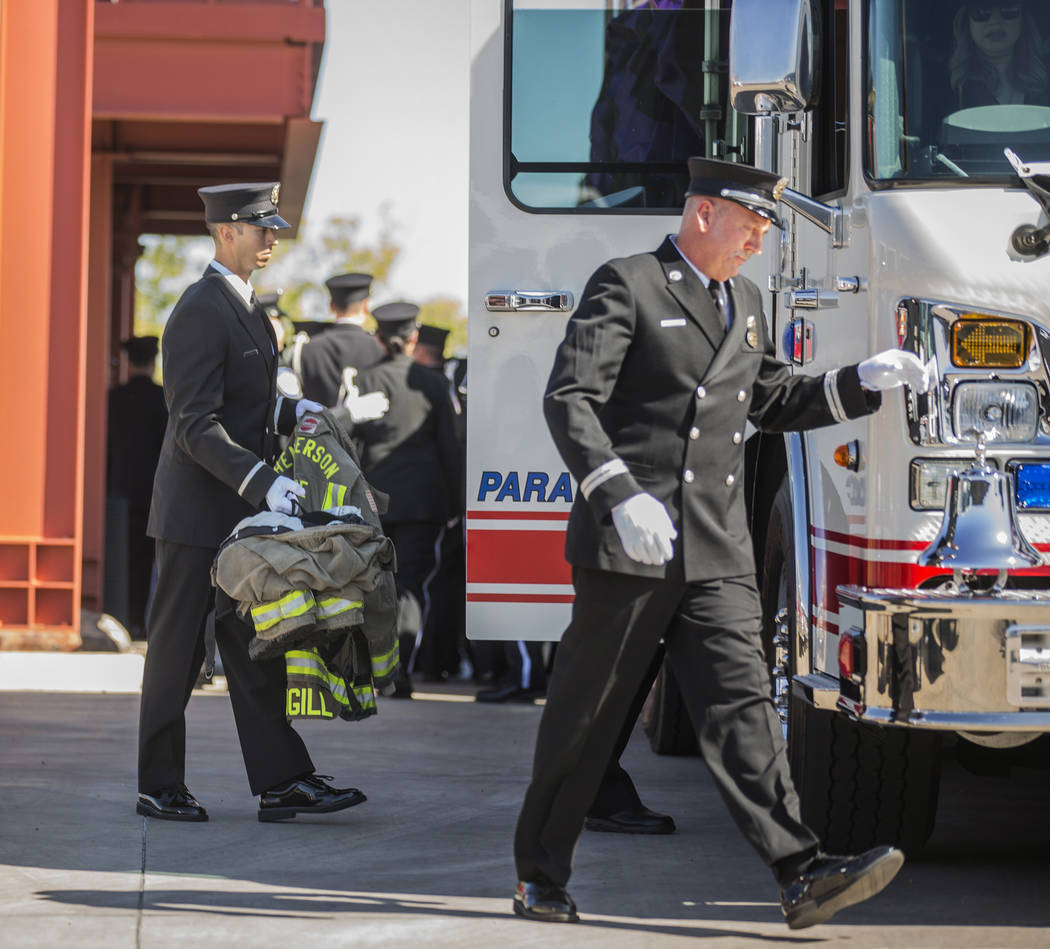 The gear of deceased Henderson Fire Department firefighter/paramedic Robbie James Pettingill is ...