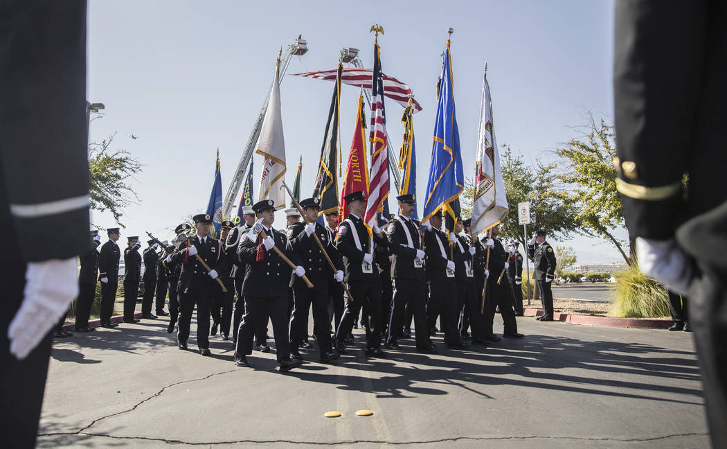 Henderson Fire and Police Department personnel march in a procession honoring Henderson Fire De ...