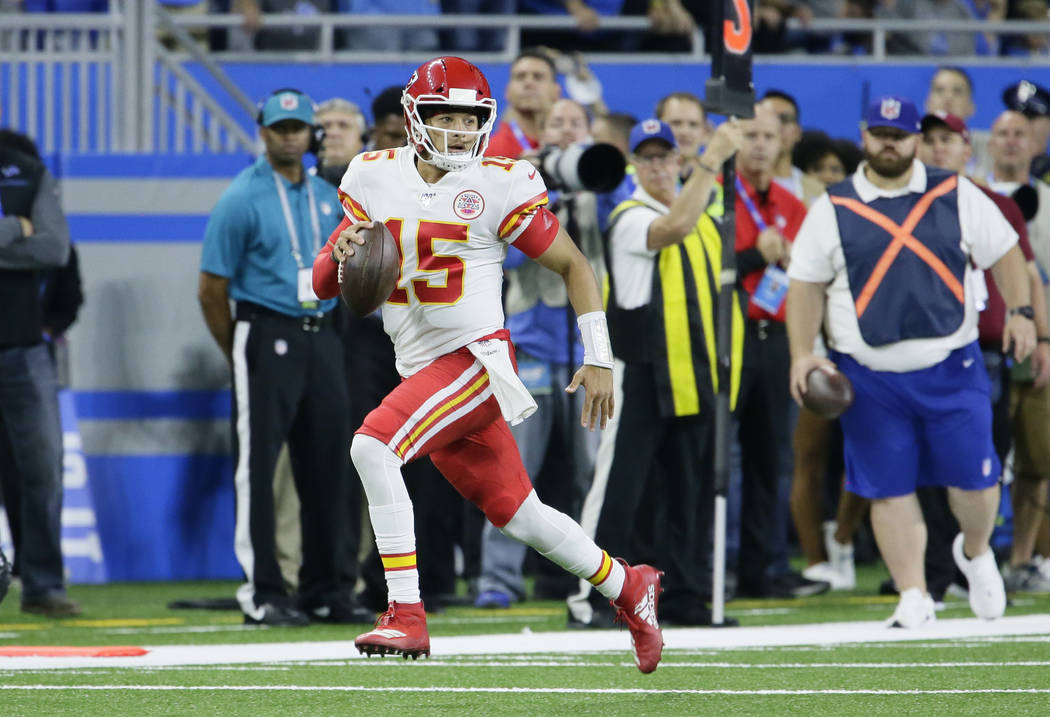 Kansas City Chiefs quarterback Patrick Mahomes (15) carries the ball against the Detroit Lions ...