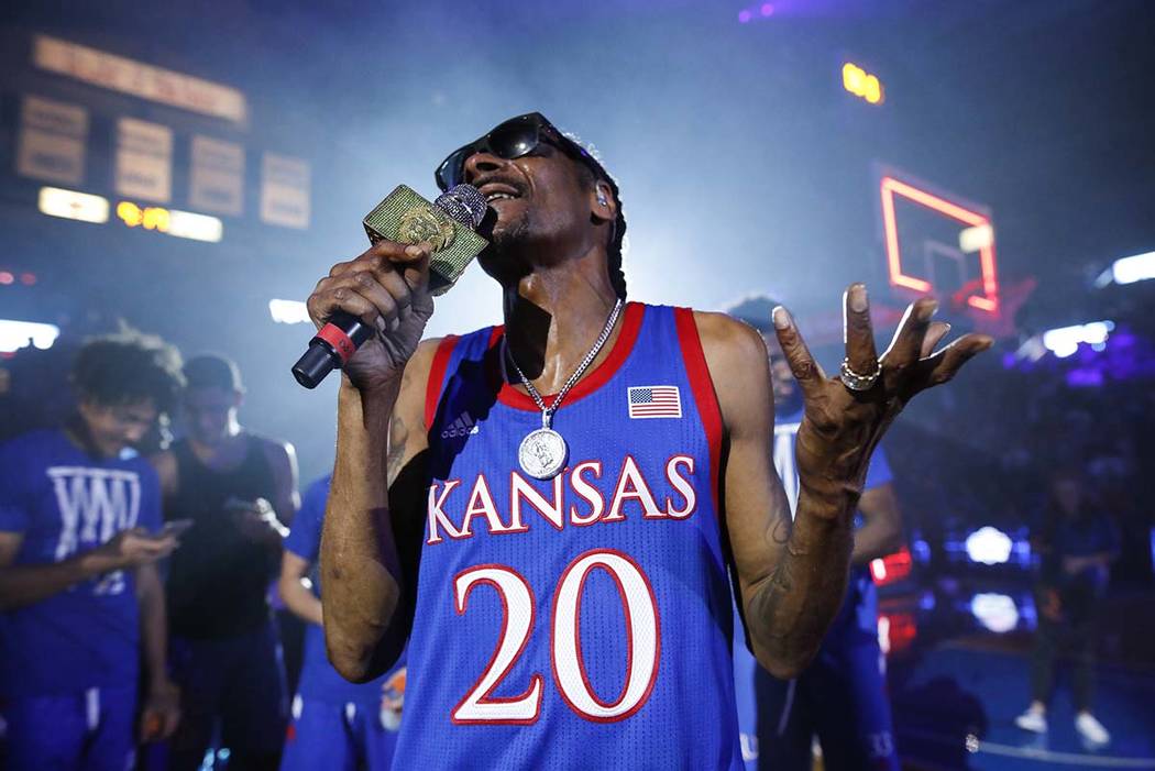 In this Friday, Oct. 4, 2019 photo, rapper Snoop Dogg performs for the Allen Fieldhouse crowd d ...