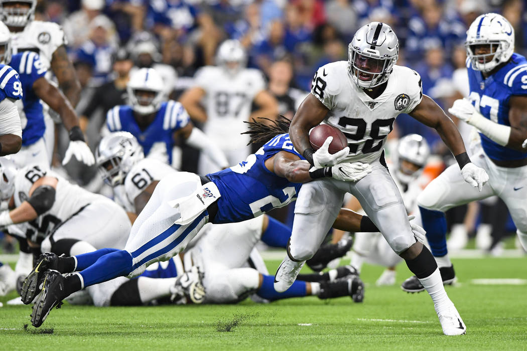 Indianapolis Colts strong safety Clayton Geathers (26) tackles Oakland Raiders running back Jos ...