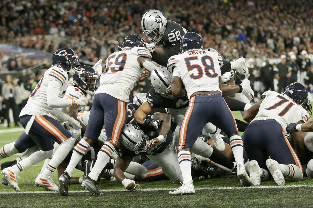 Oakland Raiders running back Josh Jacobs (28) goes in for a touchdown during the second half of ...