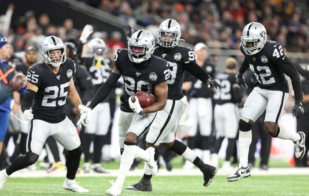 Oakland Raiders cornerback Daryl Worley (20) intercepts Chicago Bears quarterback Chase Daniel ...